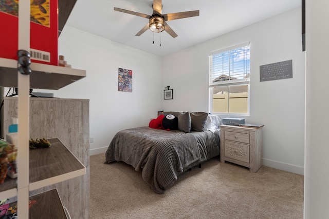 carpeted bedroom featuring baseboards and ceiling fan