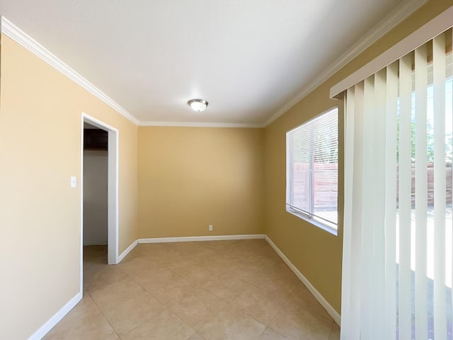 45567 Andale Ave, Lancaster, CA 93535 - spare room with crown molding, light tile patterned floors, and baseboards