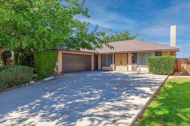 ranch-style home featuring a garage