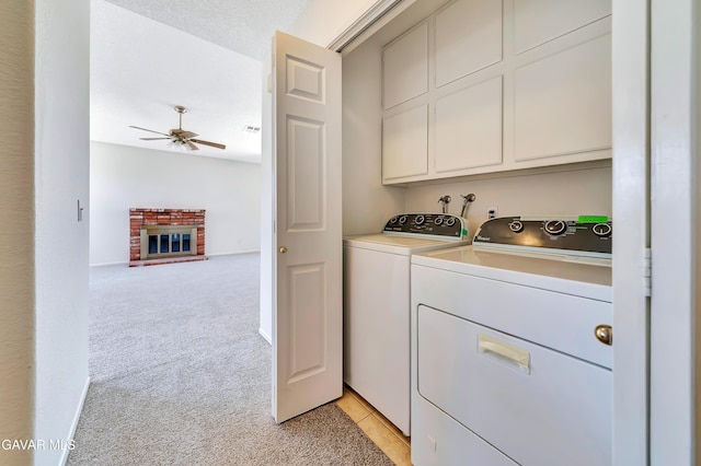 3524 San Jacinto Ave, Rosamond, CA 93560 - laundry room featuring cabinet space, washing machine and clothes dryer, ceiling fan, and light colored carpet
