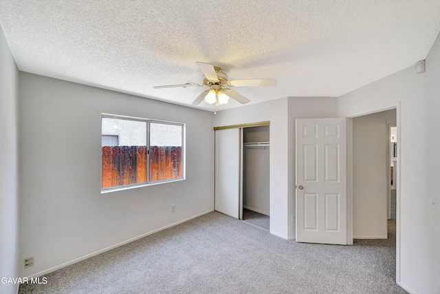 3524 San Jacinto Ave, Rosamond, CA 93560 - unfurnished bedroom featuring carpet floors, a closet, a textured ceiling, and a ceiling fan