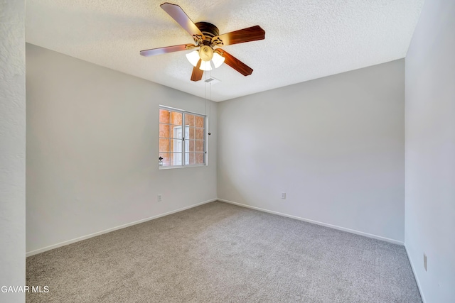 3524 San Jacinto Ave, Rosamond, CA 93560 - carpeted spare room with a textured ceiling and a ceiling fan