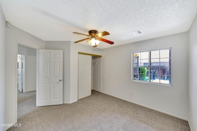 3524 San Jacinto Ave, Rosamond, CA 93560 - unfurnished bedroom with carpet floors, a closet, a textured ceiling, and a ceiling fan