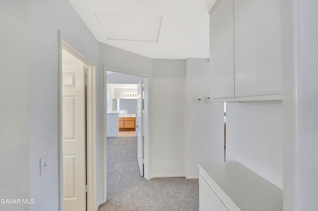 3524 San Jacinto Ave, Rosamond, CA 93560 - corridor featuring light carpet and baseboards