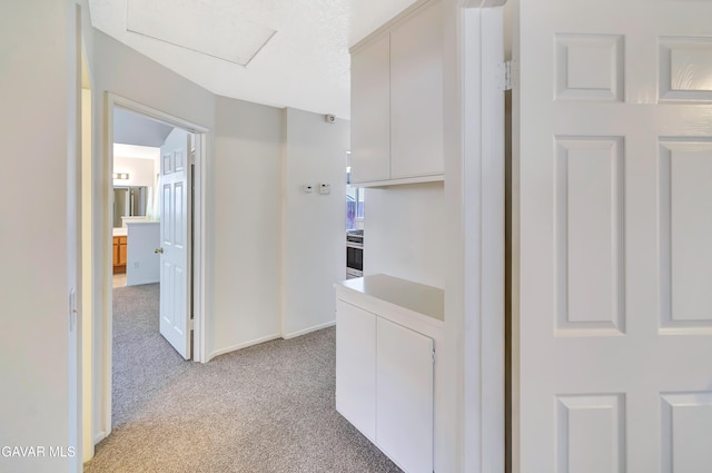 3524 San Jacinto Ave, Rosamond, CA 93560 - hallway with light colored carpet and attic access