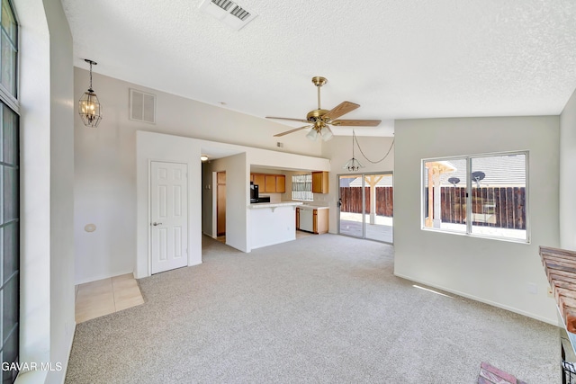 3524 San Jacinto Ave, Rosamond, CA 93560 - unfurnished living room with light carpet, a textured ceiling, and ceiling fan