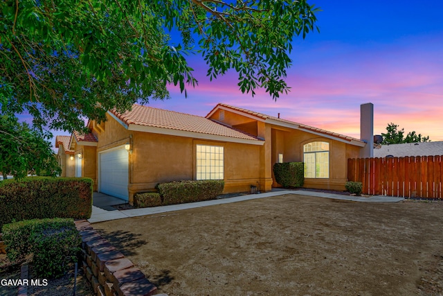 3524 San Jacinto Ave, Rosamond, CA 93560 - single story home with a tiled roof, stucco siding, and an attached garage