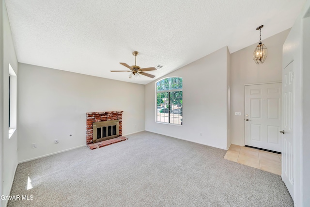 3524 San Jacinto Ave, Rosamond, CA 93560 - unfurnished living room with light colored carpet, ceiling fan, a brick fireplace, and a textured ceiling