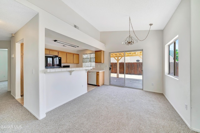 3524 San Jacinto Ave, Rosamond, CA 93560 - kitchen with light carpet, tile countertops, white dishwasher, fridge, and healthy amount of natural light