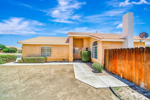 3524 San Jacinto Ave, Rosamond, CA 93560 - ranch-style house with a tile roof and stucco siding