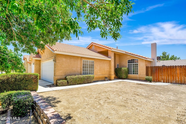 3524 San Jacinto Ave, Rosamond, CA 93560 - single story home featuring a garage, stucco siding, a tiled roof, and concrete driveway