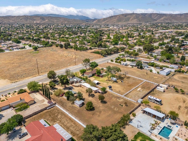 birds eye view of property with a mountain view