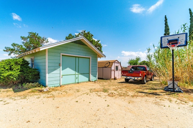 garage featuring a shed