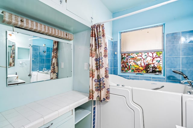 bathroom with a tub