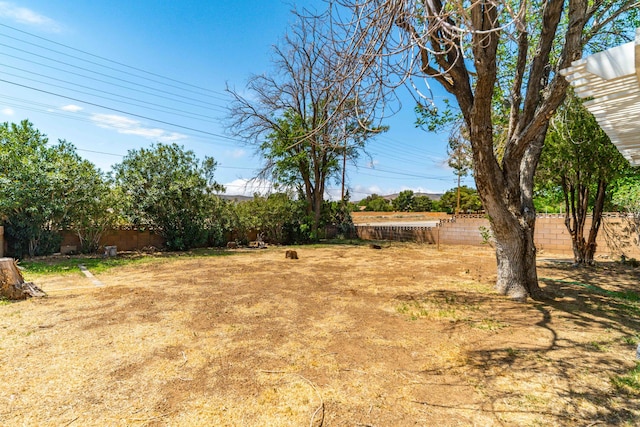 view of yard with a fenced backyard