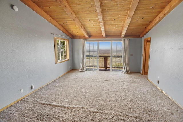 empty room featuring carpet, wood ceiling, and lofted ceiling with beams