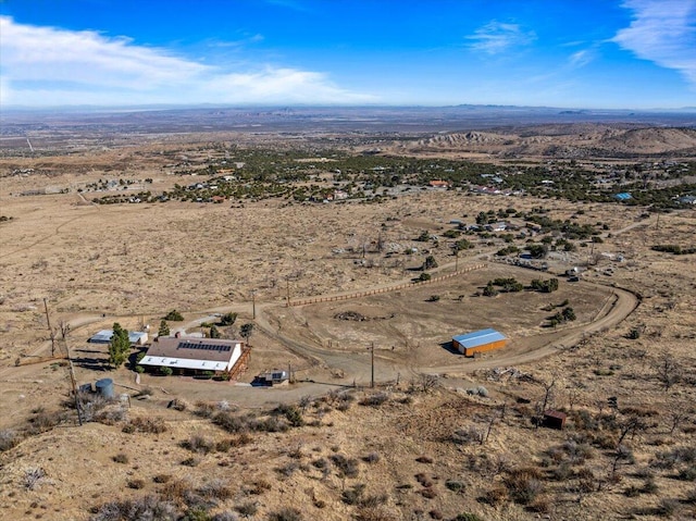 birds eye view of property featuring a desert view