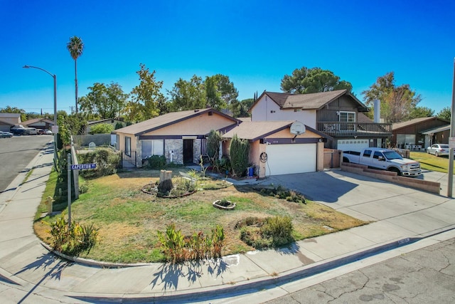 front of property featuring a balcony and a front yard