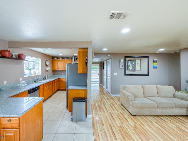 45431 Sancroft Ave, Lancaster, CA 93535 - kitchen with a sink, open floor plan, appliances with stainless steel finishes, recessed lighting, and light countertops