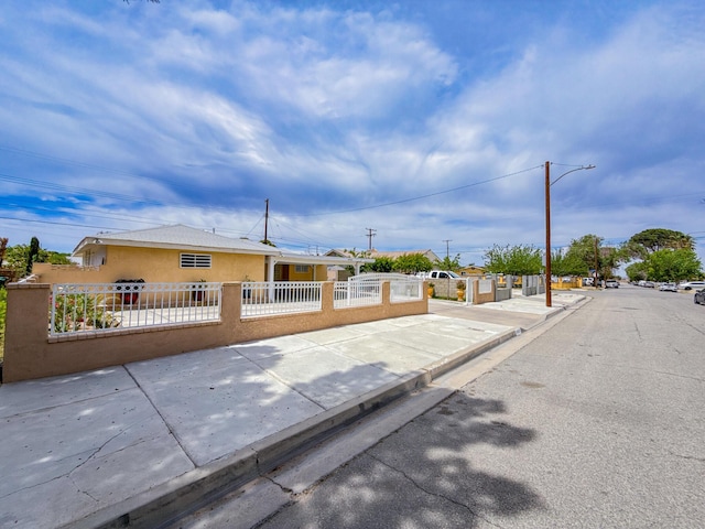 45431 Sancroft Ave, Lancaster, CA 93535 - view of front facade featuring stucco siding and a fenced front yard