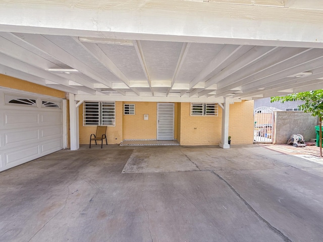 45431 Sancroft Ave, Lancaster, CA 93535 - garage with an attached carport and a gate