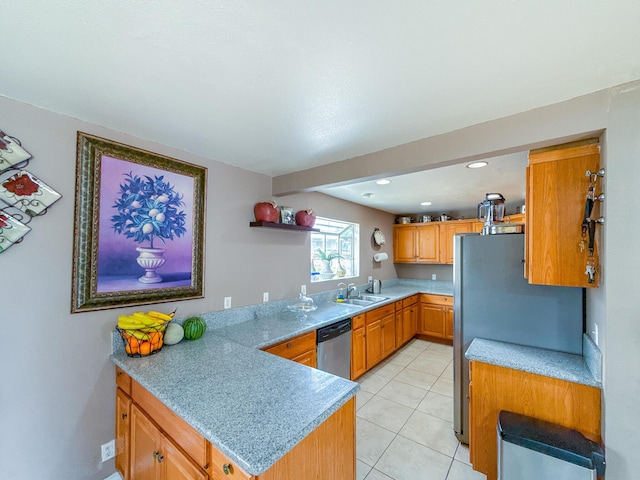 45431 Sancroft Ave, Lancaster, CA 93535 - kitchen with stainless steel appliances, a sink, a peninsula, open shelves, and light countertops