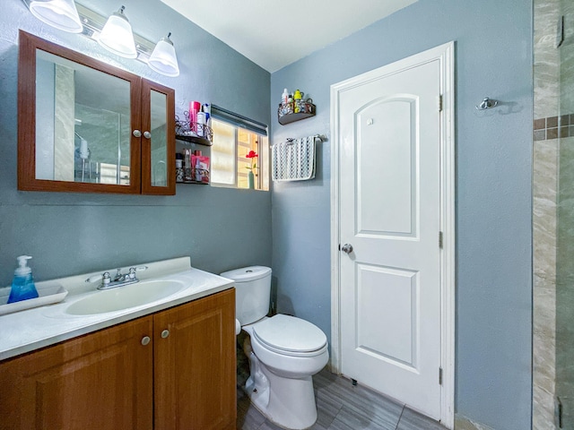 45431 Sancroft Ave, Lancaster, CA 93535 - bathroom featuring vanity, toilet, and tile patterned flooring