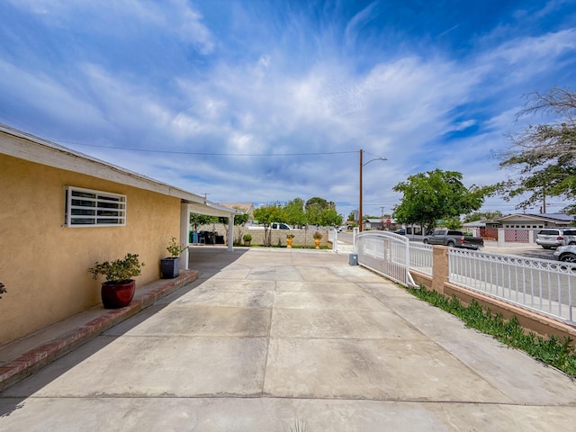 45431 Sancroft Ave, Lancaster, CA 93535 - view of concrete driveway with street lights