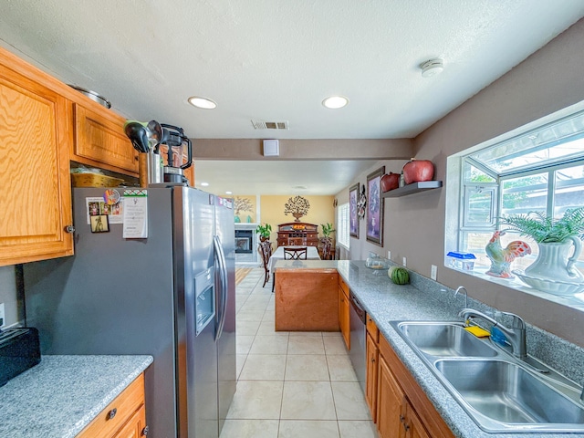 45431 Sancroft Ave, Lancaster, CA 93535 - kitchen with a sink, stainless steel fridge, dishwasher, light tile patterned flooring, and recessed lighting