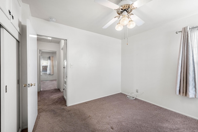 unfurnished bedroom with a closet, ceiling fan, and carpet