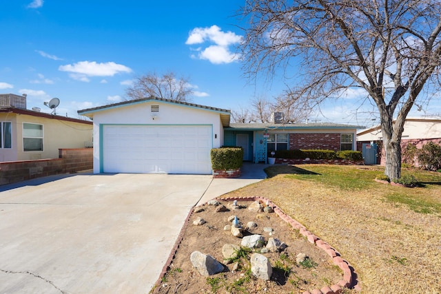 ranch-style house featuring a front yard and a garage