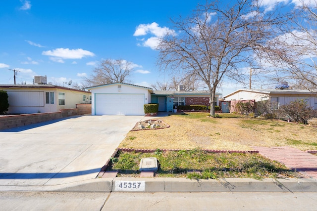 single story home with a garage and central AC