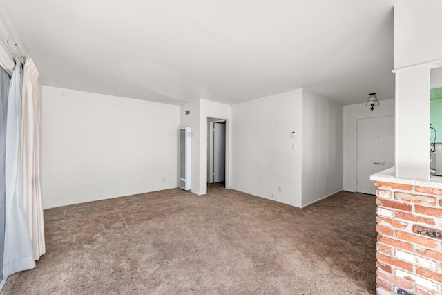 unfurnished room featuring carpet