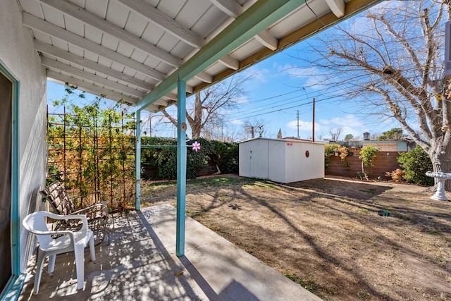 view of patio featuring a shed