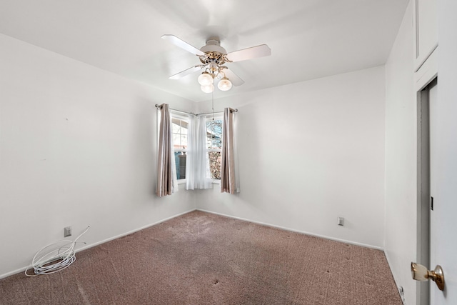 spare room featuring carpet flooring and ceiling fan