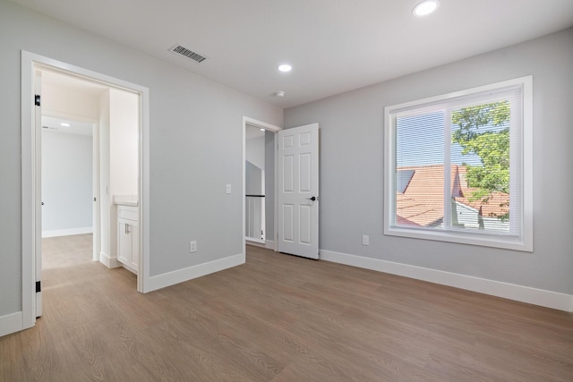 4046 Kona Ct, Palmdale, CA 93552 - unfurnished bedroom featuring light wood finished floors and recessed lighting