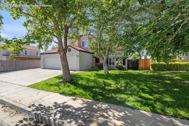 4046 Kona Ct, Palmdale, CA 93552 - view of front of property with driveway, stucco siding, a tile roof, and a garage