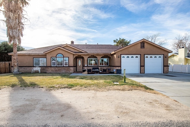 single story home featuring driveway, a front yard, fence, and stucco siding