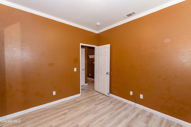 43963 Glenraven Rd, Lancaster, CA 93535 - spare room with wood finished floors, ornamental molding, and a smoke detector