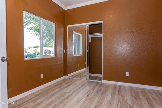 43963 Glenraven Rd, Lancaster, CA 93535 - unfurnished bedroom with crown molding, wood finished floors, and a closet