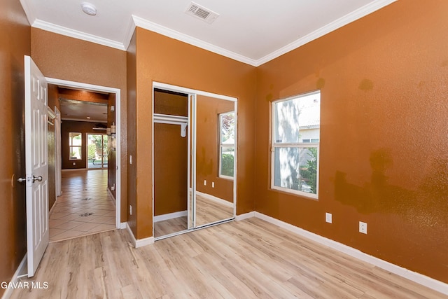 43963 Glenraven Rd, Lancaster, CA 93535 - unfurnished bedroom with ornamental molding, a closet, and wood finished floors
