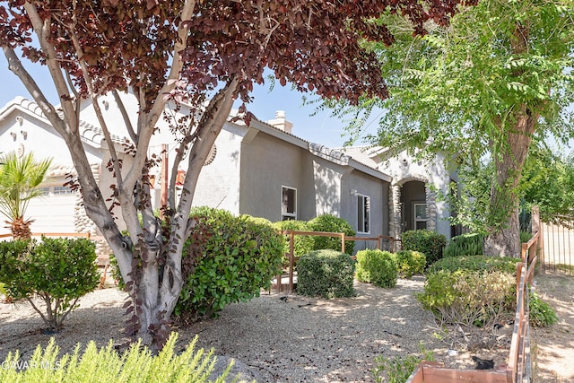 43963 Glenraven Rd, Lancaster, CA 93535 - view of front facade featuring stucco siding and a chimney