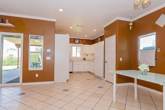 43963 Glenraven Rd, Lancaster, CA 93535 - kitchen with white fridge with ice dispenser, crown molding, tasteful backsplash, white cabinets, and light countertops