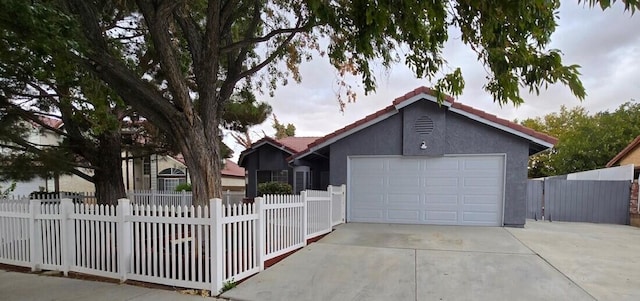 ranch-style house featuring a garage