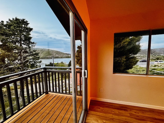 balcony with a water and mountain view