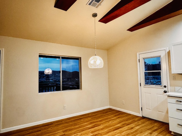 unfurnished room featuring light wood-style flooring and baseboards
