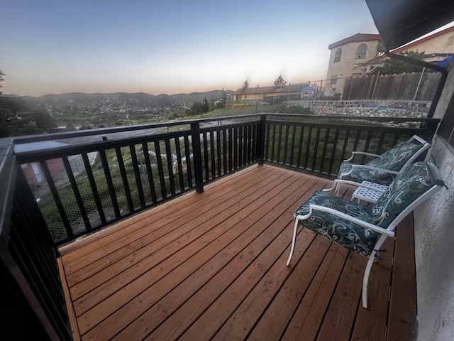 deck at dusk with fence