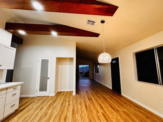 unfurnished living room featuring light wood-style floors and baseboards