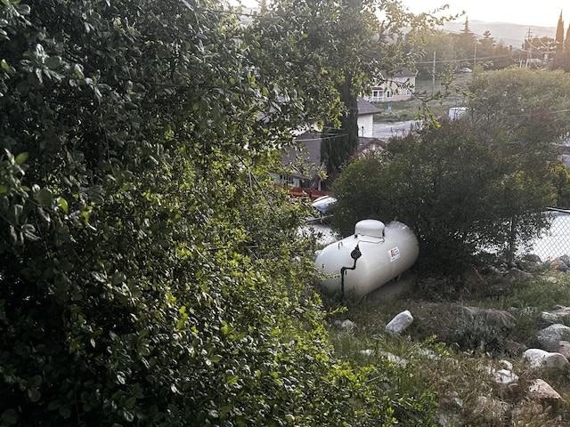 exterior view of propane tank and fence