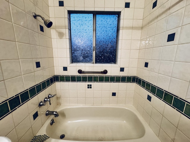 bathroom featuring a bath and a shower